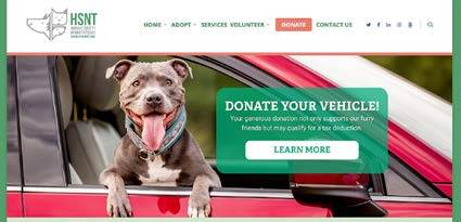 The Humane Society of North Texas homepage shows the organiza- tion’s logo, a basic navigational menu, and a photo of a large dog looking out a car window into the camera. Text next to the dog encourages viewers to donate their vehicle in support of the Humane Society.